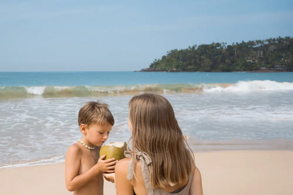 Family relaxing beside the coast in Negombo